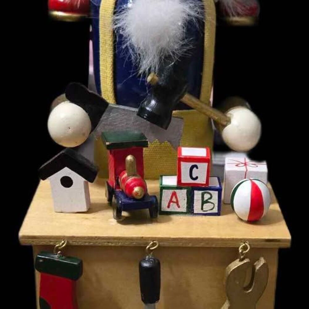 15" tall, multi-colored wooden nutcracker figurine